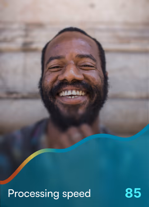 Smiling man with beard in front of a stone wall background with overlay text reading 'Processing speed 85'.