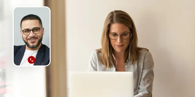 Woman with glasses on a laptop while on a video call with a man in a small screen overlay.